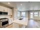 Beautiful kitchen with a central island, stainless steel appliances, and plenty of natural light at 8633 Middle Fork St, Littleton, CO 80125