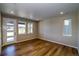 Bright living room featuring hardwood floors, recessed lighting, and large windows that offer plenty of natural light at 8633 Middle Fork St, Littleton, CO 80125