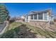Spacious backyard with lush green grass and well-kept landscaping at 20898 E Hamilton Ave, Aurora, CO 80013