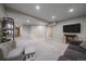 Large basement with neutral walls, plush carpeting, and ample space for various activities at 20898 E Hamilton Ave, Aurora, CO 80013