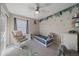 Charming room with jungle-themed decor and cozy rocking chair at 20898 E Hamilton Ave, Aurora, CO 80013