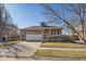 Charming brick home boasts a manicured lawn and a two-car garage at 20898 E Hamilton Ave, Aurora, CO 80013
