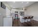 Stylish kitchen with a granite island, stainless steel appliances and adjacent dining area at 20898 E Hamilton Ave, Aurora, CO 80013