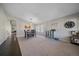 Spacious living room with natural light and a dining table at 20898 E Hamilton Ave, Aurora, CO 80013