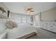 Bright main bedroom with large windows, plush bedding, and a calming color palette at 20898 E Hamilton Ave, Aurora, CO 80013