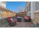 Outdoor patio with stone pavers, comfortable seating, and a fire pit for entertaining at 20898 E Hamilton Ave, Aurora, CO 80013