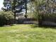 A spacious backyard with lush green grass and a well-maintained wooden fence at 4609 S Kalispell Way, Aurora, CO 80015