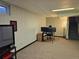 Spacious basement area with multiple computer monitors, ideal for an office at 4609 S Kalispell Way, Aurora, CO 80015