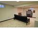 Finished basement featuring a brick fireplace and comfortable seating area at 4609 S Kalispell Way, Aurora, CO 80015