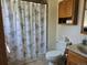 Bathroom with shower and floral shower curtain at 4609 S Kalispell Way, Aurora, CO 80015