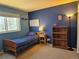 Comfortable bedroom features carpet, natural light and a cool two-tone color scheme at 4609 S Kalispell Way, Aurora, CO 80015