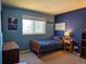 Blue painted bedroom with window and natural light at 4609 S Kalispell Way, Aurora, CO 80015