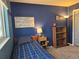 Comfortable bedroom features carpet, natural light and built in shelving at 4609 S Kalispell Way, Aurora, CO 80015
