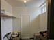 Walk-in closet with storage, shelves, hanging rod and window in room at 4609 S Kalispell Way, Aurora, CO 80015