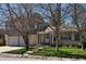 Charming two-story home with attached two-car garage, brick and siding and a well-maintained lawn at 4609 S Kalispell Way, Aurora, CO 80015