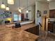 Open kitchen with earth-tone countertops and stylish pendant lighting at 4609 S Kalispell Way, Aurora, CO 80015