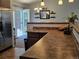 Kitchen with stainless steel refrigerator and backyard access at 4609 S Kalispell Way, Aurora, CO 80015