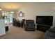 Open-concept living space with dining area, plush seating, and natural light, creating a warm and inviting environment at 4609 S Kalispell Way, Aurora, CO 80015