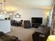 Inviting living room featuring neutral walls, plush seating, and a large entertainment center for a comfortable ambiance at 4609 S Kalispell Way, Aurora, CO 80015