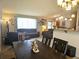 Spacious living room with comfortable seating, a dining area, and ample natural light for a cozy and inviting space at 4609 S Kalispell Way, Aurora, CO 80015