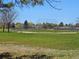 Community park with a grass field, baseball diamond, and a walking path at 4609 S Kalispell Way, Aurora, CO 80015