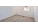 Clean, carpeted, and simple bedroom with natural light at 10880 E Hinsdale Cir, Centennial, CO 80112