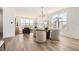 Open concept living and dining area with hardwood floors and modern furnishings at 10880 E Hinsdale Cir, Centennial, CO 80112