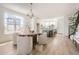 Bright dining area with a round table, stylish chairs, chandelier, and views of the outdoors at 10880 E Hinsdale Cir, Centennial, CO 80112