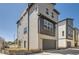 New construction two-story home with gray siding and an attached garage at 10880 E Hinsdale Cir, Centennial, CO 80112
