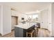 Modern kitchen with an island, seating, stainless steel appliances, and sleek cabinetry at 10880 E Hinsdale Cir, Centennial, CO 80112