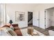 Bright living room with white walls, minimalist decor, and modern furniture at 10880 E Hinsdale Cir, Centennial, CO 80112