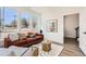 Cozy living room with modern decor, large windows, and a comfortable seating area at 10880 E Hinsdale Cir, Centennial, CO 80112