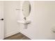 Elegant powder room with pedestal sink, modern fixtures, and minimalist design at 10880 E Hinsdale Cir, Centennial, CO 80112