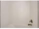 Clean shower featuring white tiling with brushed gold fixtures at 10880 E Hinsdale Cir, Centennial, CO 80112