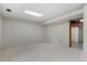 Unfurnished basement with neutral carpet, paint, and trim at 7563 Lamar Ct, Arvada, CO 80003