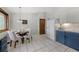 Inviting dining area with natural light, seating for four, and a view of the adjacent kitchen at 7563 Lamar Ct, Arvada, CO 80003