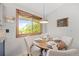 Charming dining nook with a view, offering a cozy and bright space for meals at 7563 Lamar Ct, Arvada, CO 80003