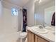 Bathroom with a shower-tub combination and a light wood vanity with a large mirror at 11811 Lewiston St, Commerce City, CO 80022