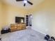 Bedroom featuring neutral carpet and walls with a large window providing natural light at 11811 Lewiston St, Commerce City, CO 80022