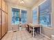 Cozy breakfast nook features natural light and table for two, perfect for casual dining at 11811 Lewiston St, Commerce City, CO 80022