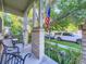 Inviting front porch with seating and lush landscaping, providing curb appeal at 11811 Lewiston St, Commerce City, CO 80022
