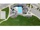 Aerial view of a community pool and playground surrounded by green spaces at 19475 W 94Th Ave, Arvada, CO 80007