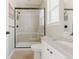 Well-lit bathroom with a shower behind a glass door and a modern sink at 19475 W 94Th Ave, Arvada, CO 80007