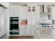 Modern kitchen featuring stainless steel appliances, granite countertops, and a tiled backsplash at 19475 W 94Th Ave, Arvada, CO 80007