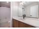 Well-lit bathroom featuring sleek vanity, modern fixtures, and a shower-tub combination at 2076 S Holly St # 1, Denver, CO 80222