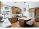 Bright kitchen with stainless steel appliances, modern white countertops and a central island at 2076 S Holly St # 1, Denver, CO 80222