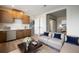 Inviting living room with a wet bar, hardwood floors, and comfortable contemporary furniture at 2076 S Holly St # 1, Denver, CO 80222