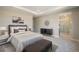 Serene main bedroom with plush carpeting, tray ceilings, and an en-suite bathroom at 2076 S Holly St # 1, Denver, CO 80222