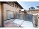 Back yard patio area, with a privacy fence and partial snow cover at 3742 S Granby Way, Aurora, CO 80014