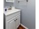 Close up of single-sink bathroom vanity featuring classic white cabinets, laminate countertops, and brushed nickel hardware at 3742 S Granby Way, Aurora, CO 80014